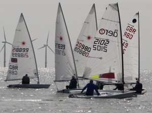 Eager to start, dinghies begin to bunch on the line
