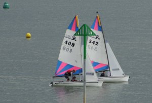 "Two Salty Nuts" is the windward boat, with "Touch 'n' Go" about to be overhauled