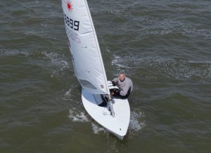  Tim Dye takes fourth place overall in his Laser