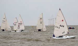 Andy Dunnett leads at the start, from the Inner Distance Mark, in his Laser