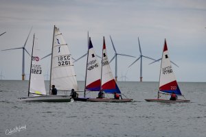 The Toppers make a colourful sight as they mingle with the other dinghies (photo thanks - Colin N Waddell)