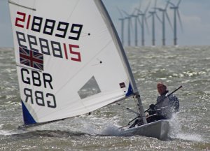 Tim Dye takes victory in the first race, in his Laser