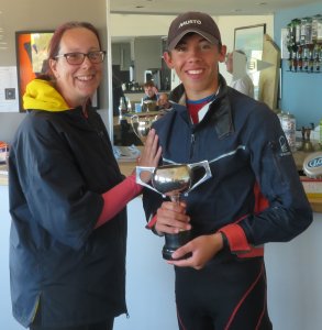 Adam receives the Orsted Cadet Splash Race Trophy as the overall winner in his Laser