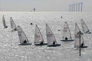 The start gets underway, with Tim Dye (far right) on port tack, whilst Ken Potts heads towards him on starboard