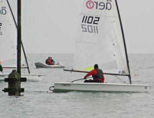 John Tappenden passes the Inner Distance Mark at the start, in his RS Aero