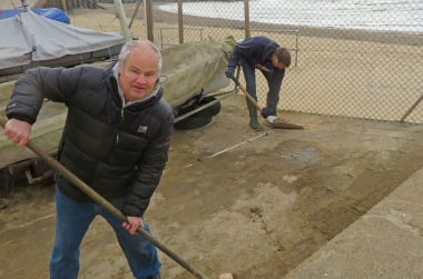 Clearing the sand in the compound