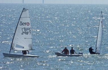Simon Clarke cuts it fine, on the third start, cutting behind the Rescue Boat on port