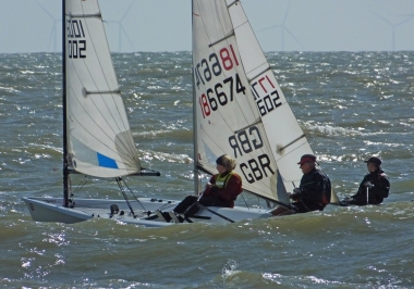 Level pegging for Ella Langfeldt in her RS Aero, and father and son Simon and Adam Kedge in their Lasers