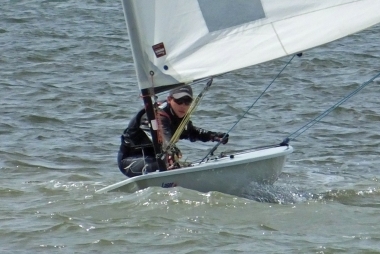 Adam Kedge sailing to victory in his Laser