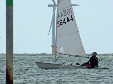 Jono Dunnett takes his Laser to victory